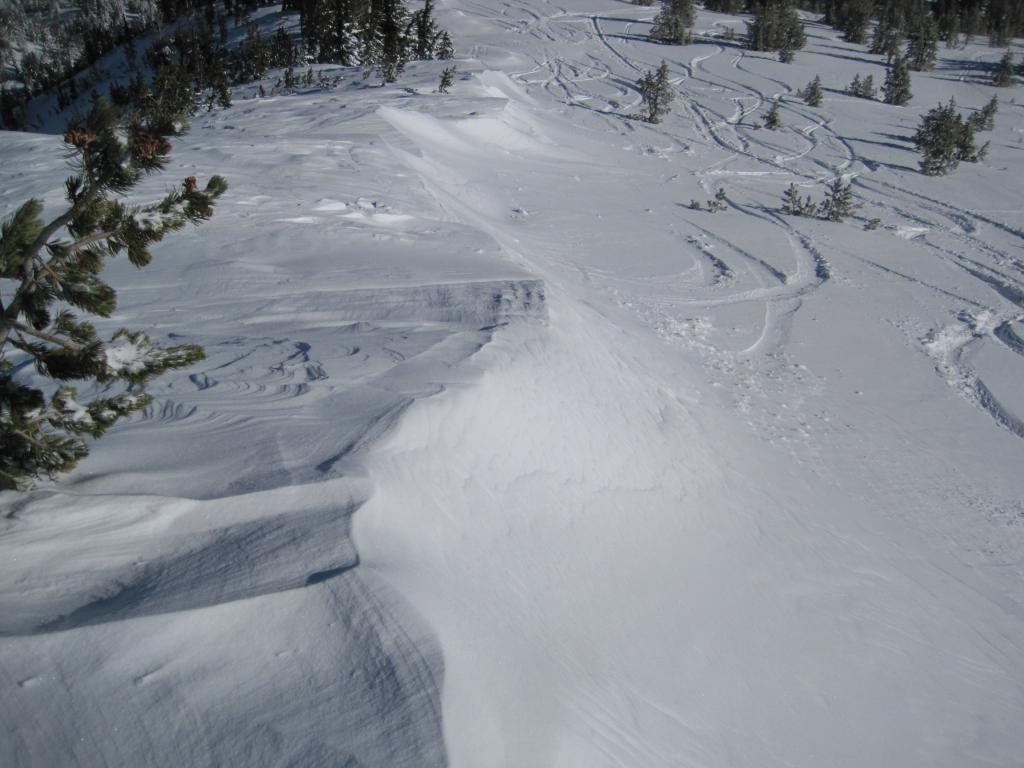  NE winds scouring N/NE <a href="/avalanche-terms/aspect" title="The compass direction a slope faces (i.e. North, South, East, or West.)" class="lexicon-term">aspects</a> and moving snow along ridge. 