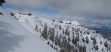 Large cornices looming over the Corkscrew slide path. Very small natural loose snow slides observed near these cornices.