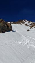 Skier triggered roller balls on micro E aspect on gully wall (back of photo).