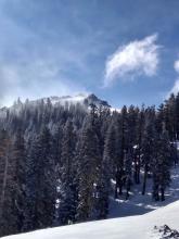 As I ascended higher on the peak blowing snow could be seen near the summit.