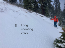 Wind loaded road cut test slope with only 1 inch of old snow below new slab, but enough to allow shooting cracks over smooth ground.