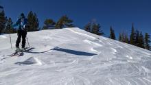 Wind affected surfaces near the ridgeline.