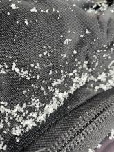 Precipitation particles were mostly small flakes and sometimes small ice pellets like shown here.