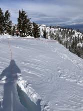 Large cracking of cornice with redline outline downhill piece