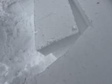 Clean planar fracture between wind slabs and old snow interface.