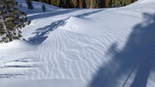 Ripples in the snow surface created by wind on a N aspect near the ridge.