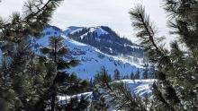 NE winds blowing snow along the ridge of Donner Peak