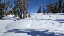 Shallow and small deposits of wind-blown snow on a SW aspect at around 9600 ft.