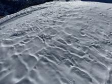 Firm wind affected snow around the summit of Echo.