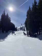 Sheltered Northern facing terrain in foreground and wind / solar effect snow in background.