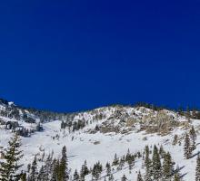 Looking up at the SE facing cliffs boring north bowl on Tallac. There was minimal evidence of previous wet loose activity below.