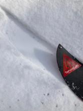 About an inch of snow sitting on soft saturated snow at the 7400 foot trailhead