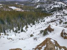 Thin snowcover across the N aspect avalanche start zones on the Far East Ridge of Tamarack Peak.