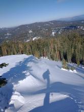 Cornices along Lincoln Ridge are still large enough to act as avalanche start zones despite recent NE wind scouring.