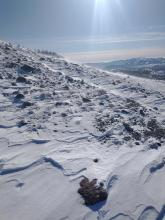 Minor amounts of drifting snow over the ridgetop.