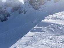 Natural D2 wind slab avalanche on N. Side of Castle Peak.