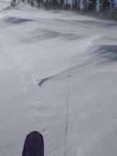 Old long cracks and drifting snow along the ridgetop between Castle Pass and Andesite Peak.