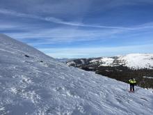 Wind scoured snow down to old ice layer along the Ridgeline above tree line.