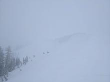 Blowing snow obscured visibility near the summit, but we could still see huge cornices above the E face of Mt. Judah.