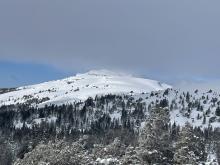 Large cornices on Meiss Meadow ridge line and low lying cloud cover on the crest.