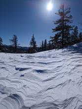 The direction of these erosion patterns indicate previous NE winds